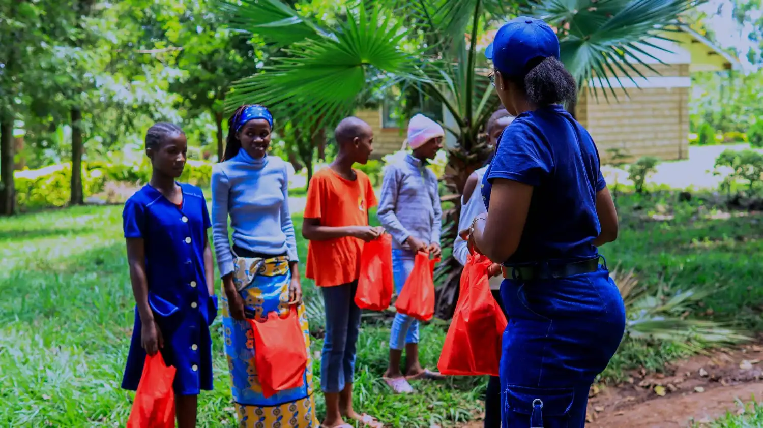 Volunteer organizing sanitary towel packages for distribution